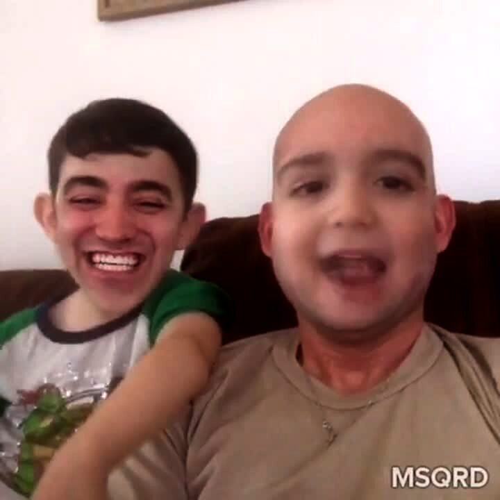Video thumbnail showing: A man and a tot boy do a face swap in the living room. Face Swaps