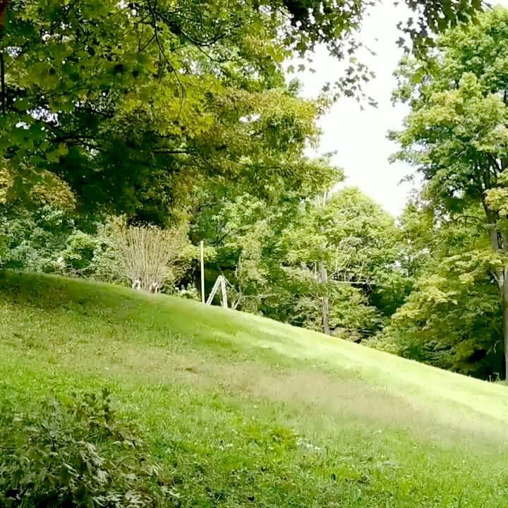 Video thumbnail showing: A man rides a zip line through a field and  falls off at the end.